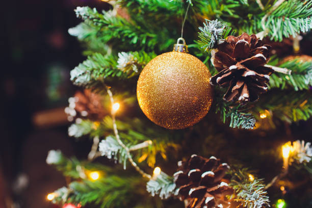 istock Christmas background - baubles and branch of spruce tree. 1133468666