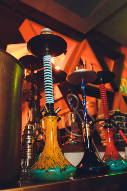 istock group of red hookahs shisha on table in interior. 1133468724