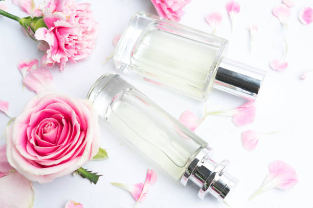 istock Beautiful perfume bottles on pink background 1133468731