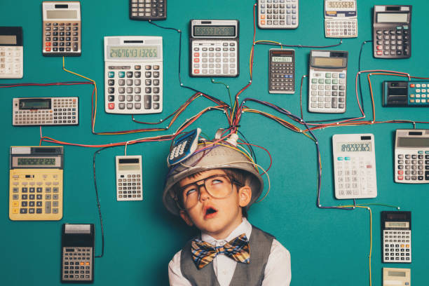 istock Young Nerd Boy Overworked with Calculator Invention 1133471927