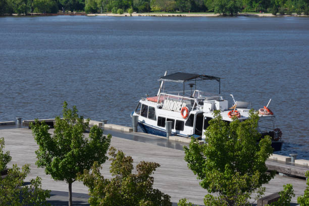 istock River Cruise Boat Alongside Pier 1133474773