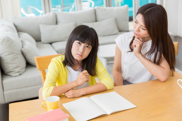 istock asian parent and daughter 1133476257
