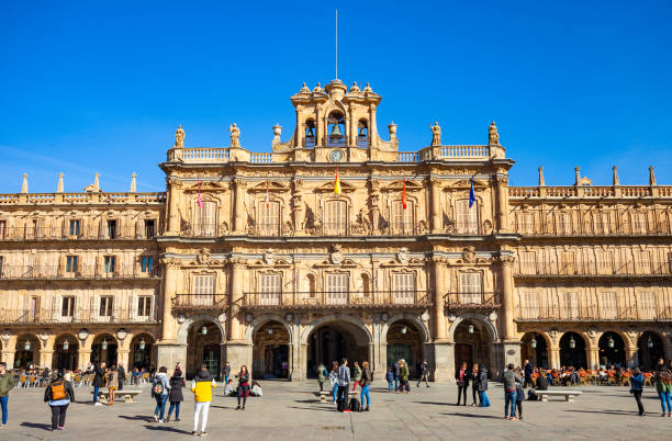 Salamanca, Spain - February 16, 2019:  People enjoy the Plaza Mayor in Salamanca, Spain on a sunny day.