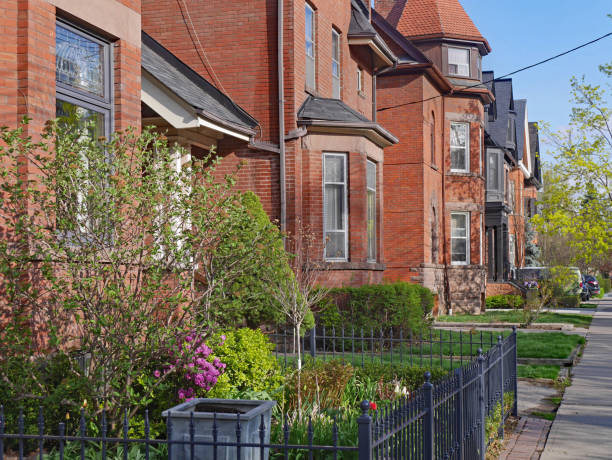 istock street with large old Victorian houses 1133478646