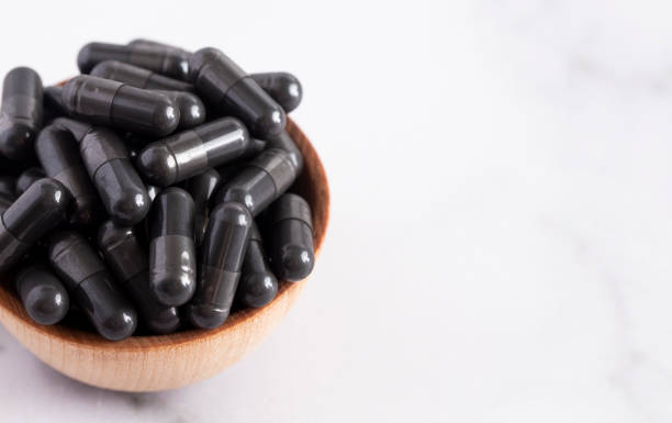 istock A Bowl Full of Activated Charcoal Capsules 1133481932