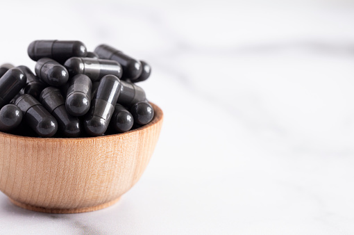 A Bowl Full of Activated Charcoal Capsules