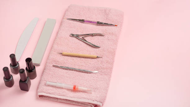 istock Manicure tool on a pink towel and pink background. studio shot 1133485248