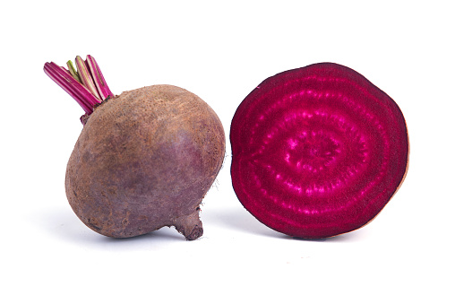 Single Beetroot And Cross Section Isolated On White