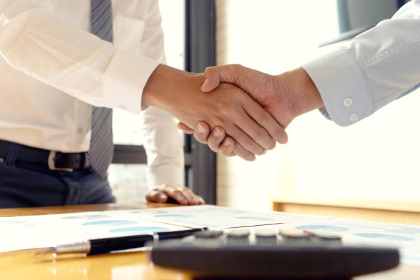 istock executive businessman hand shake with another business 1133486047