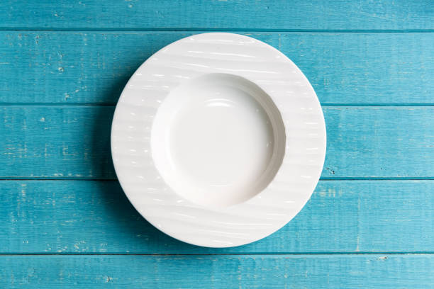 istock Empty white plate on wooden background, Top view 1133486078