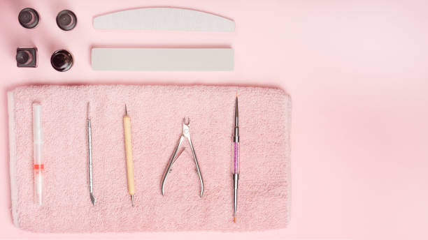 istock Manicure tool on a pink towel and pink background. studio shot 1133486120