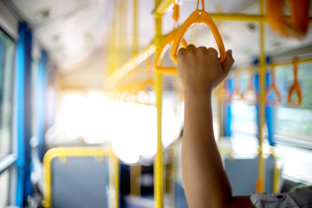 istock inside the bus yellow hand grip for the passenger to hold 1133486187