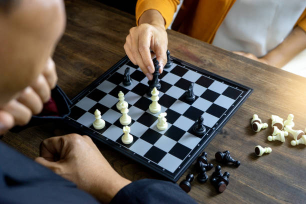 istock Businessman play chess how  to crash overthrow the competitor 1133488216