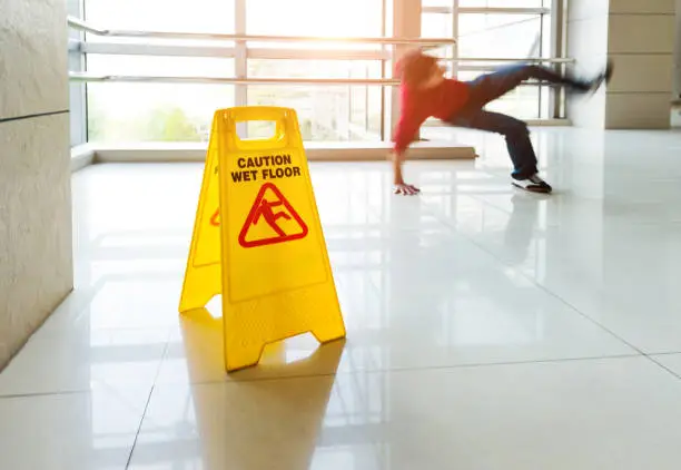 Photo of Man slips falling on wet floor