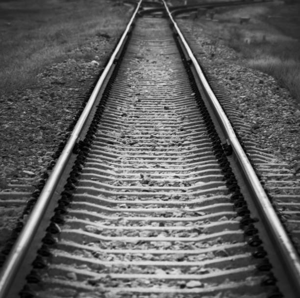 istock Black and white railroad track 1133497075