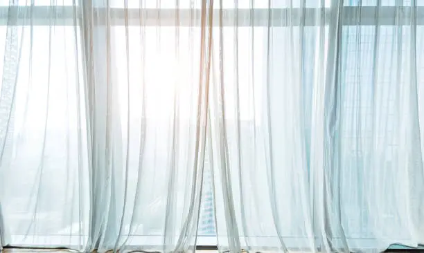 Photo of White curtain hanging in the window