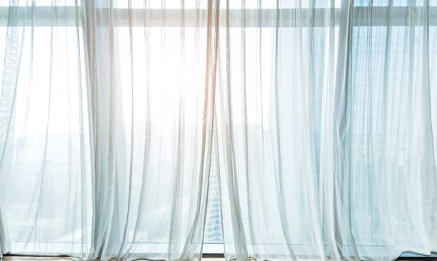 white curtain hanging in the window - indoors window elegance tranquil scene imagens e fotografias de stock