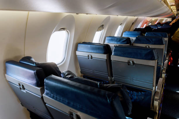 istock Left armchairs in a built-in chairs Aircraft Cabin Economy class 1133498191