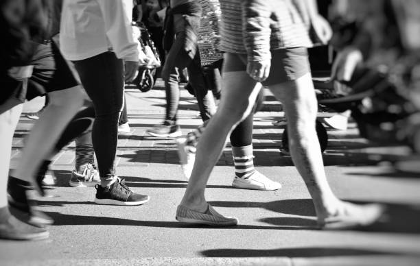 istock Black and white people walking. 1133500517