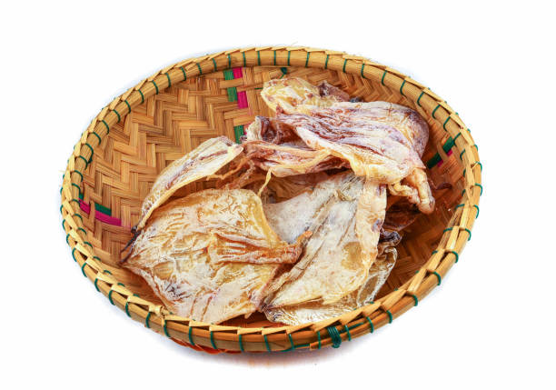 istock Dried squid on threshing basket isolated on white background 1133500712