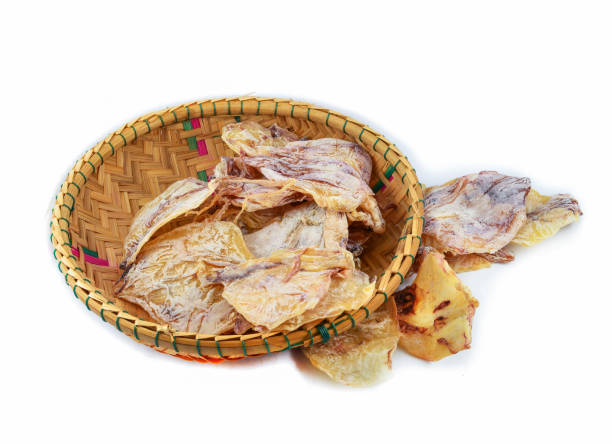 istock Dried squid on threshing basket isolated on white background 1133500713