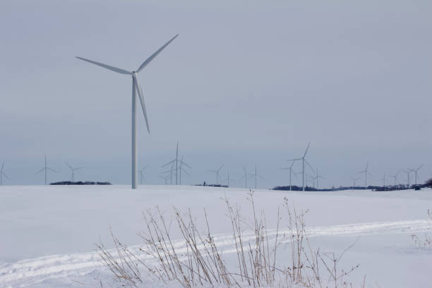 istock Snowy rural winter landscape with wind turbines 1133503464