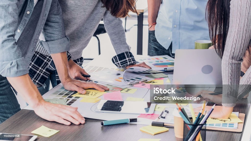 Close up creative designer applaud for job success at meeting table at office. Close up creative designer applaud for job success at meeting table at office Marketing Stock Photo