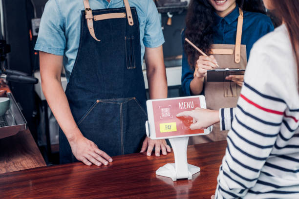 istock customer self service order drink menu with tablet screen at cafe counter bar,seller coffee shop accept payment by mobile.digital lifestyle concept 1133505968