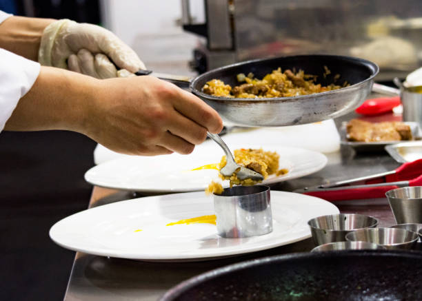 istock Chef preparing food, meal, in the kitchen, chef cooking, Chef decorating dish 1133506986