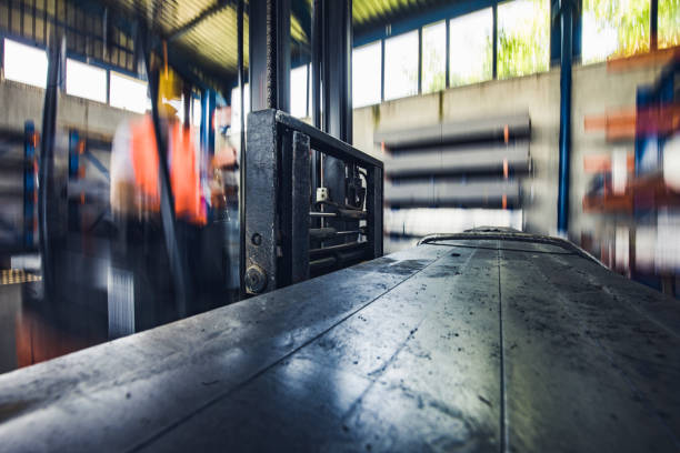 istock Close up of a forklift in motion at warehouse. 1133510740