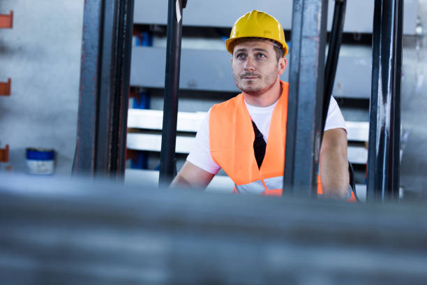 istock Manual worker driving a forklift in a warehouse. 1133511406