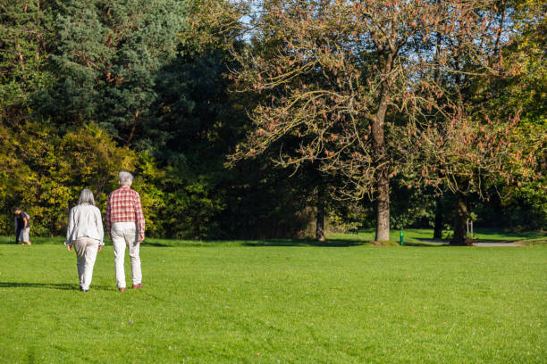 Couple in wide brim hat lying side by side on the sunny waterfront, ( Self Portrait )