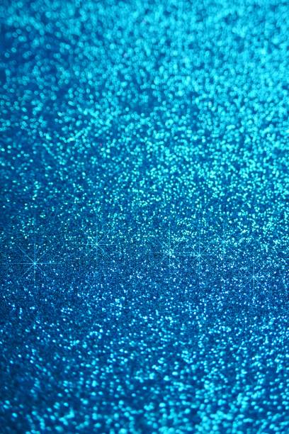 istock Glitter wallpaper. Glitter blue iridescent background with stars. Shiny backdrop.Snowy blue glitter shiny abstract Background. 1133516396