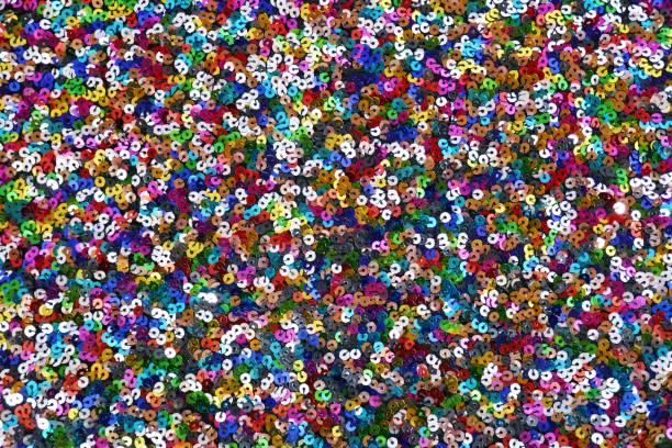 istock Sequins background.Multicolored sequins.Glitter iridescent fabric. fabric background.sparkling sequined textile 1133516436