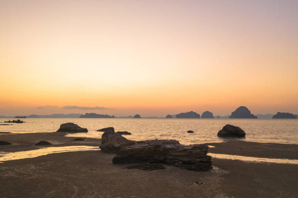 istock aerial view sunset behind big stone on Tupkaek beach Krabi 1133516708