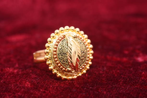 fancy designer precious jewelry golden ring closeup macro image on red background for woman - diamond shaped fotos imagens e fotografias de stock