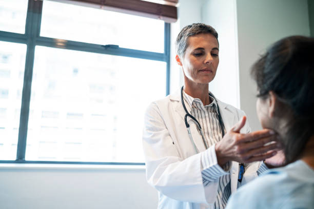 istock Doctor examining patient's throat in ward 1133517861