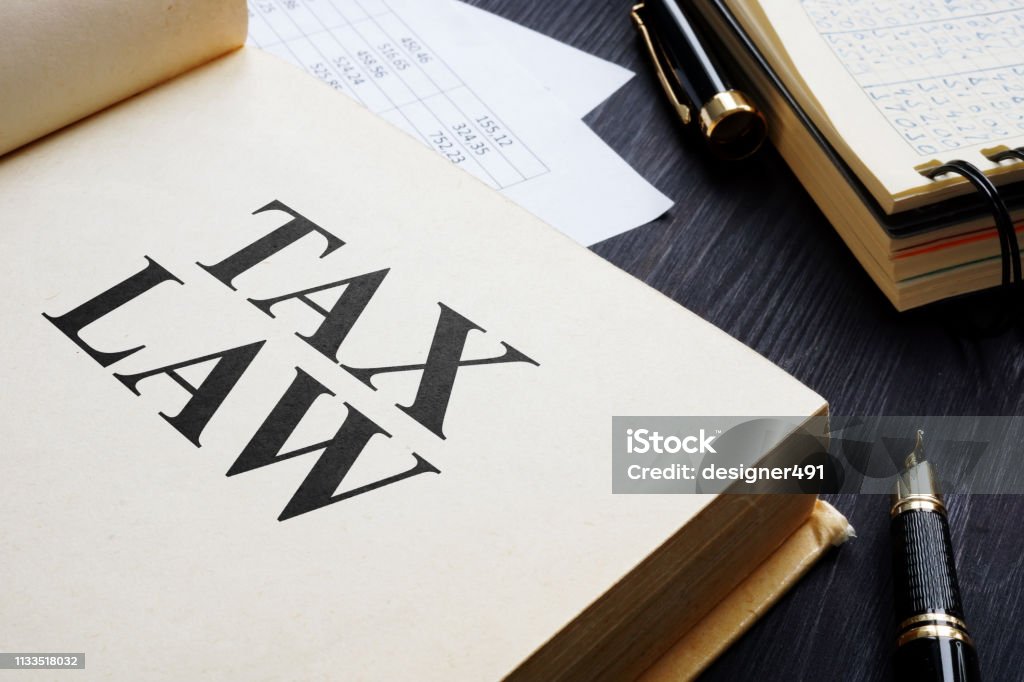 Tax law and accounting report on a table. Tax Stock Photo