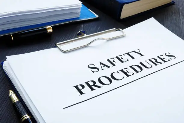 Photo of Workplace health and safety Procedures with clipboard.