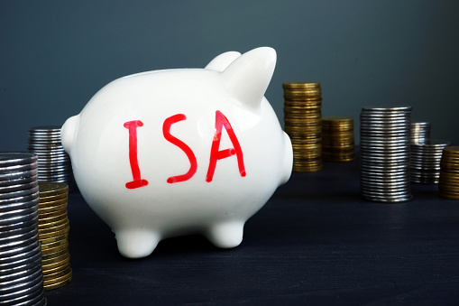 Individual savings account ISA written on a side of piggy bank.