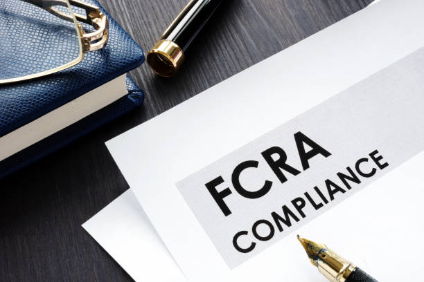 istock FCRA compliance form on a wooden desk. 1133518228