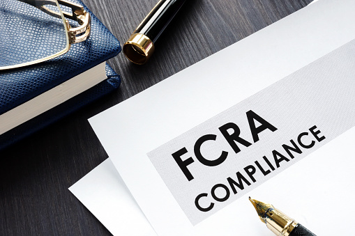 FCRA compliance form on a wooden desk.