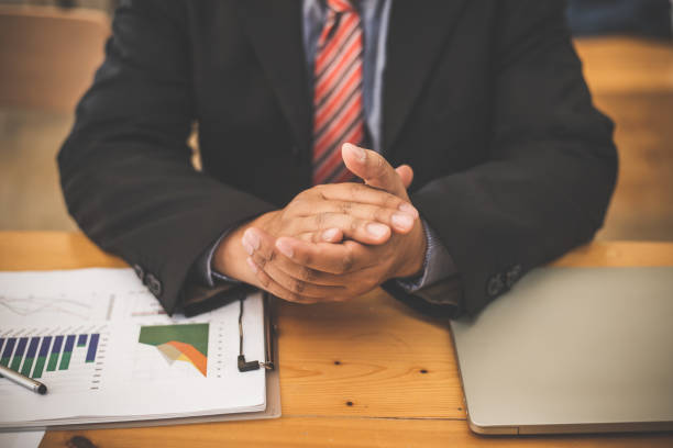 istock Banker business man working graph data supply and demand market. 1133519560