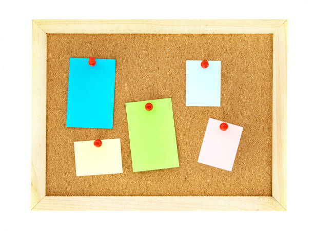 istock pin a color note paper on cork pin board  , isolated on white 1133520508