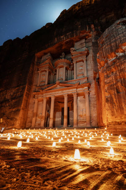 Petra by night, Treasury ancient architecture in canyon, Petra in Jordan Petra by night, Treasury ancient architecture in canyon, Petra in Jordan jordan middle east photos stock pictures, royalty-free photos & images
