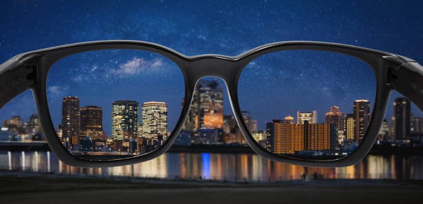 istock looking city at night with starry sky through glasses, focus on lens 1133521934