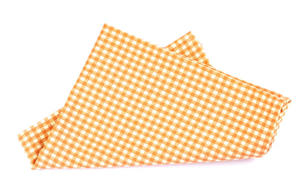 istock orange brown checkered napkin table clothes  on white background. 1133522818