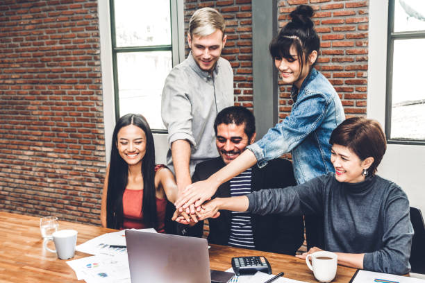 istock Successful of group business people stack and putting their hands together at office.Friendship teamwork concept 1133523074