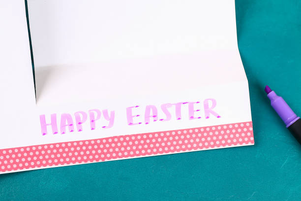 istock Diy Easter eggs made of cardboard and potato stamp, Easter greeting card on green background. 1133523279