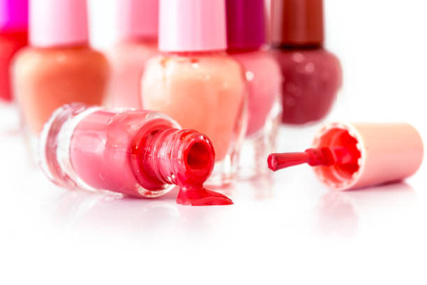 close up bottles of the color bright fashion  polish , cosmetics and beauty nail polish art concept - pampering nail polish make up spilling imagens e fotografias de stock